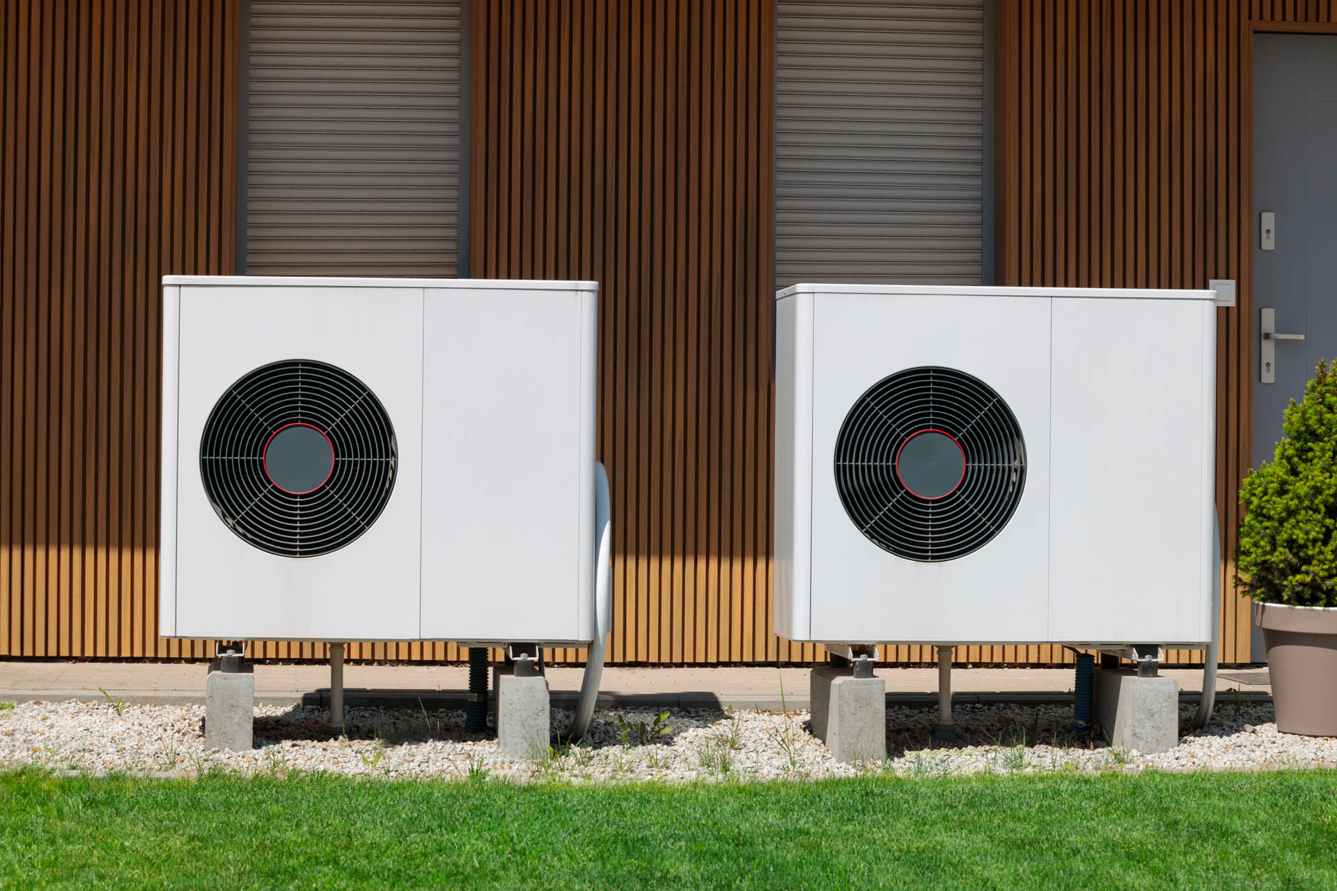 A Modern house with renewable energy: air source heat pumps installed A Modern house with renewable energy: air source heat pumps installed